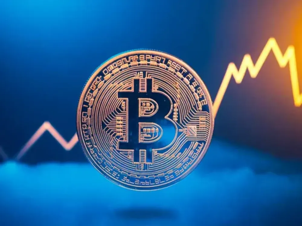 Une pièce de Bitcoin brillante sur un fond bleu et orange, symbolisant la croissance et le succès de la cryptomonnaie.