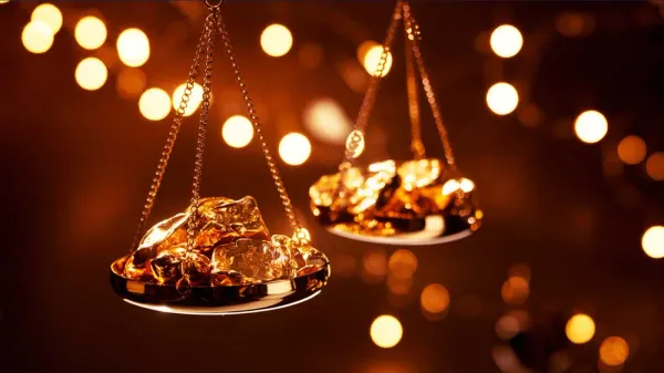 Balance dorée avec des pépites d'or, symbolisant la valeur et la pesée de l'or dans un contexte financier.